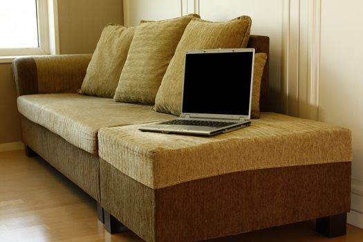 sun room corner interior detailed with laptop sofa 