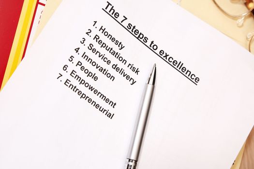 The 7 steps to excellence concept - tools use in company workshop.