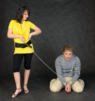 Guy chained in a chain and the girl