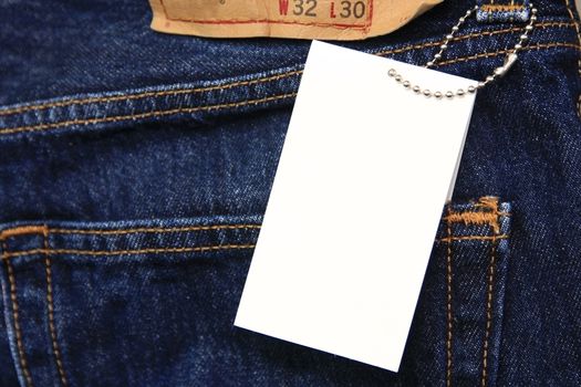 blank price tag with copyspace on jeans
