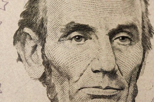 Close-up Of A Five Dollar Note With Lincoln