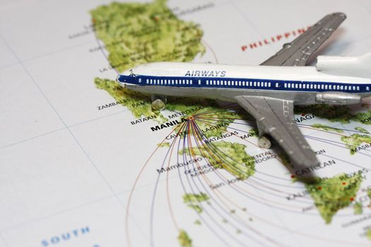 Travel to Manila concept with map and airplane toy