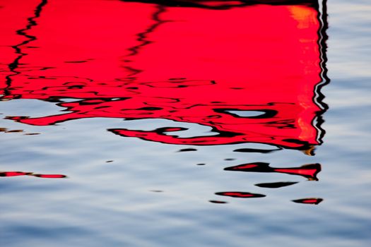 Red reflections on the water, the morning light