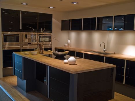 Modern design trendy kitchen with black and wood elements 