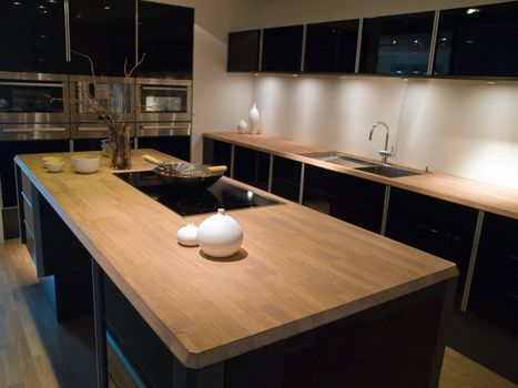 Modern clean design trendy kitchen with black wooden elements 