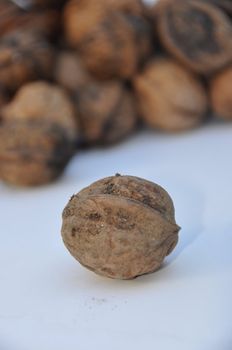 A big pile of nuts over white background