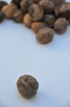 A big pile of nuts over white background