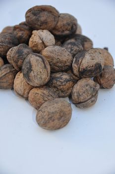 A big pile of nuts over white background