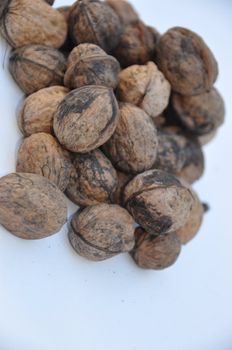 A big pile of nuts over white background