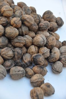 A big pile of nuts over white background