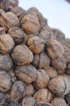 A big pile of nuts over white background