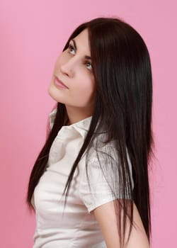 portrait of a young caucasian woman, pink background