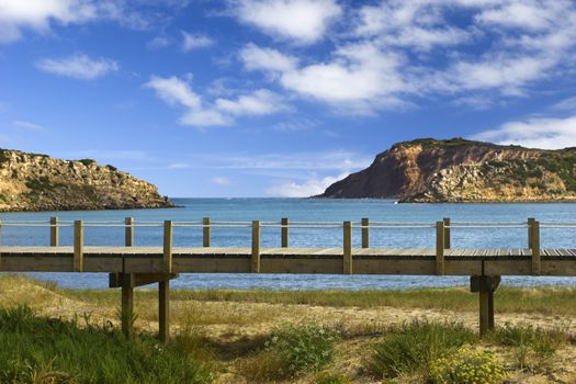 Picture of a Wood bridge crossing the beach