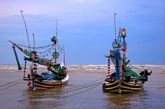 Traditional fishing boats docked at the small fishing village of Pasir Putih, Java, Indonesia.