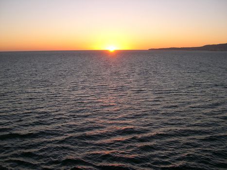 sunsetting on the ocean. I saw this as I was leaving port in Long Beach CA.