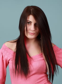 caucasian girl with long hair, blue background