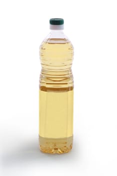 A bottle of light colored vegetable oil with blank label -  clipping path included