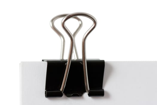 Macro view of black paper clip isolated over white