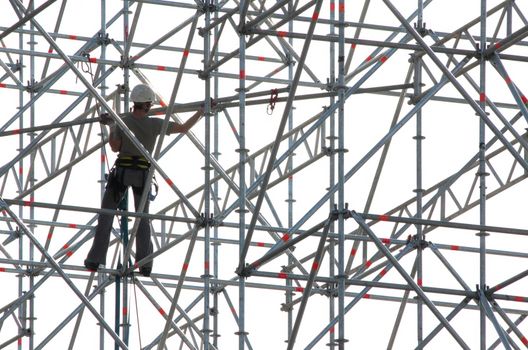 Constructive work builds on a metal stand structure.