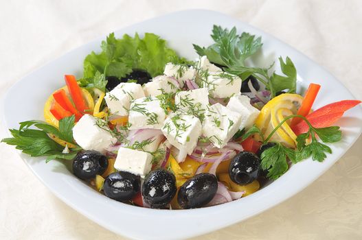 Slices of cheese in a salad of feta cheese and diced vegetables