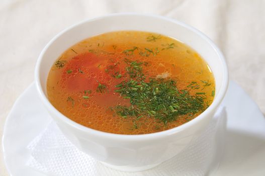 white bowl with soup, strewed dill