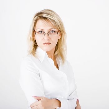 serious beautiful girl with glasses on a white background
