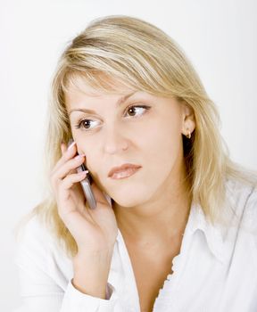 portrait of blonde girl with a mobile phone
