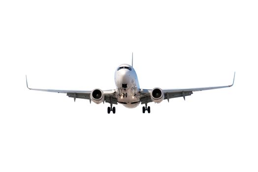 Large commercial airplane flying overhead either after departure or landing isolated on white.