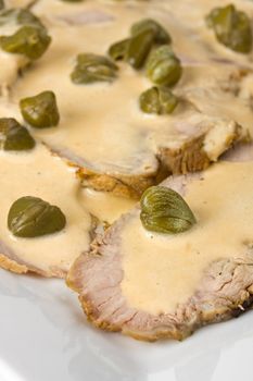 detail of vitello tonnato on a plate