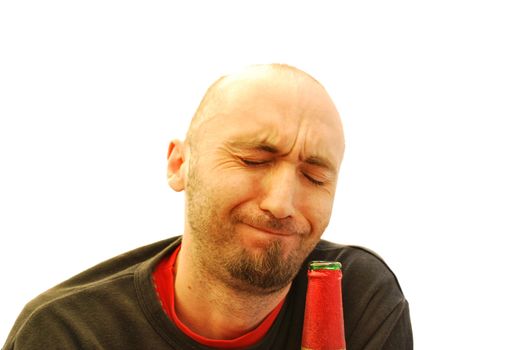 Young man drinking from a bottle of beer