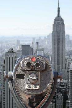 Photo of binoculars pointed at downtown Manhattan.
