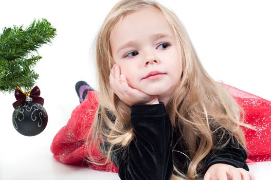 Beautiful baby girl dressed up for Christmas isolated in white