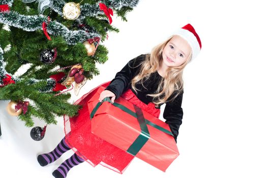 Beautiful baby girl dressed up for Christmas isolated in white