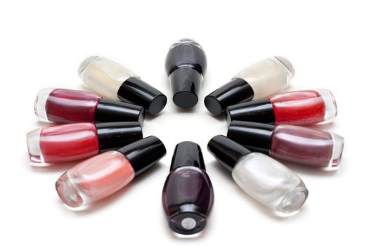 Vials colour varnish nailwaer, make-up insulated on white background