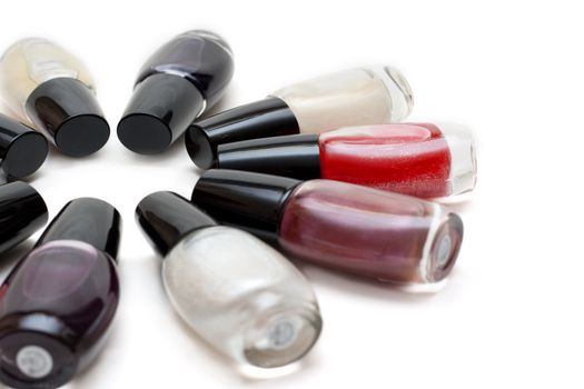 Vials colour varnish nailwaer, make-up insulated on white background