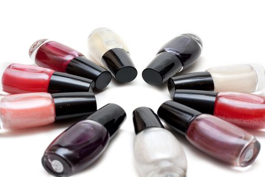 Vials colour varnish nailwaer, make-up insulated on white background