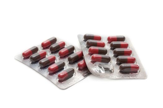 Capsules with vitamin packed insulated on white background