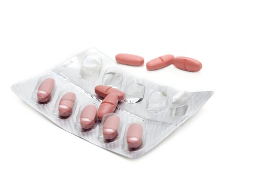 Capsules with vitamin packed insulated on white background