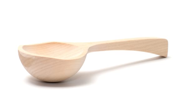 Wooden spoon it is isolated on a white background.