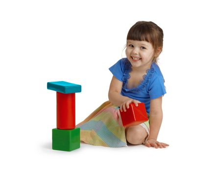 Little happy girl playing with color toys isolated on white background