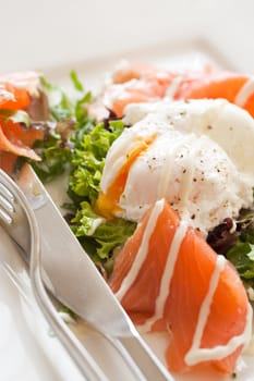 Appetizer with smoked salmon and a poached egg