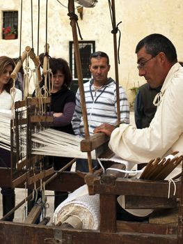 MDINA, MALTA - APR19 -  Weaver using medieval tools in Mdina in Malta April 19, 2009