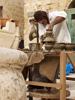 MDINA, MALTA - APR19 -  Potter using medieval tools in Mdina in Malta April 19, 2009