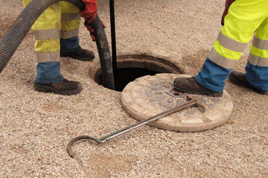 sewer workers in action