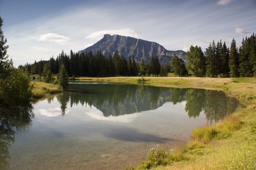 Cascade Pond in August in Banff National Park Canada with Canadian Rockies in the background