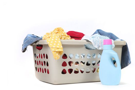 Full Basket of Dirtly Laundry With Detergent Ready to Be Washed