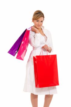 Young woman with shopping bags standing isolated on white background