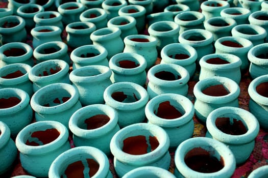 A background of freshly painted clay pots.