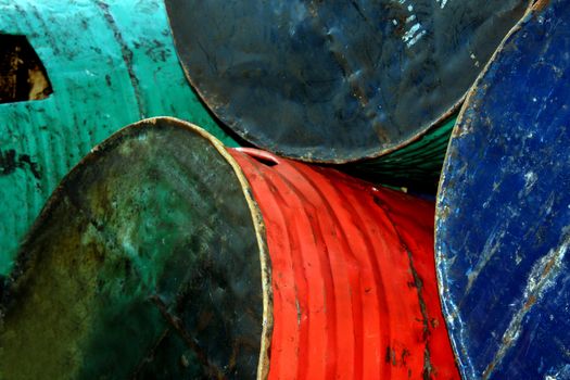 A background of old oil drums.