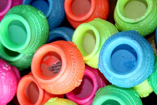 A background of colorful pots with traditional religious designs, for diwali festival in India.